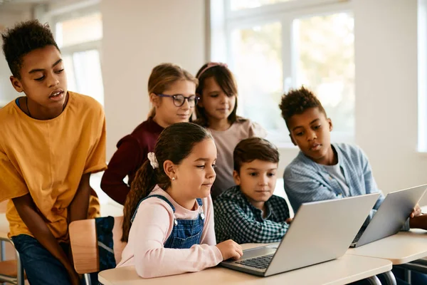 depositphotos_589409276 stock photo group elementary students learning while